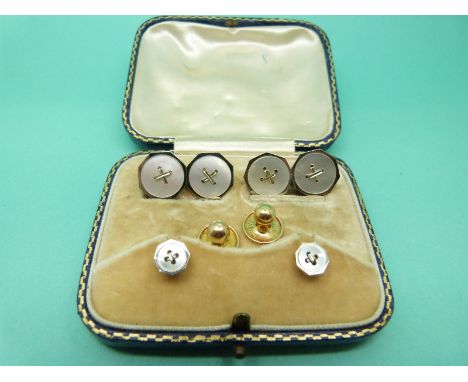 A pair of 18ct and 9ct gold cufflinks set with mother of pearl with two matching studs and a further two hallmarked 15ct gold