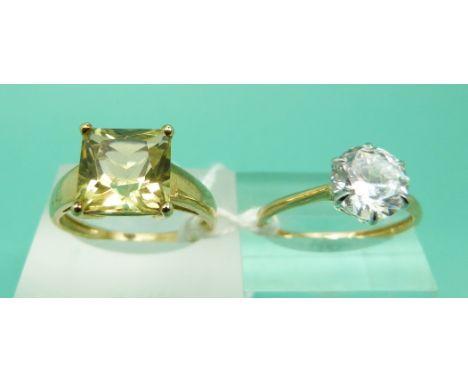 A 14ct gold ring set with cubic zirconia and a 9ct gold ring set with a citrine 