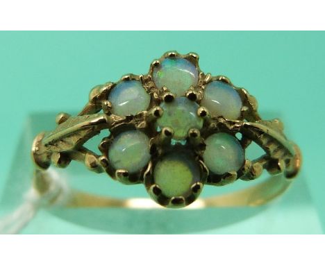 A 9ct gold ring set with opals in a flower cluster (Size R)