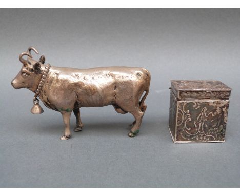 A white metal or similar novelty cow snuff or similar case with detachable head, length 9cm, together with a hallmarked silve