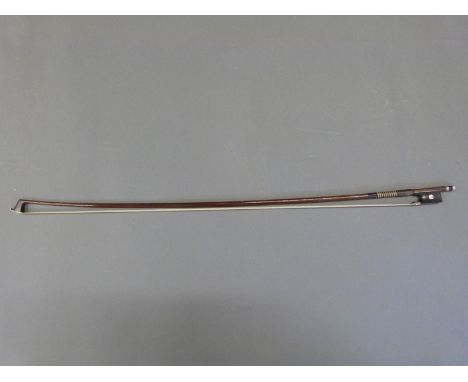 A Weichold violin bow with mother-of-pearl inlay