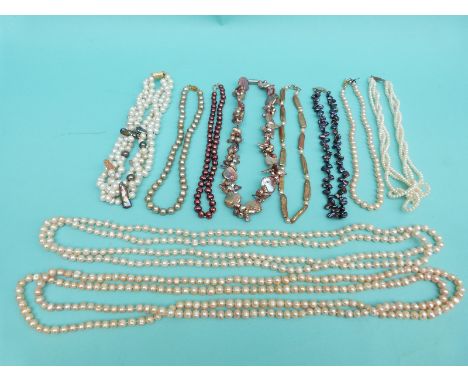 Ten pearl necklaces including single strands of freshwater pearls, a three strand pearl necklace, two very long freshwater pe