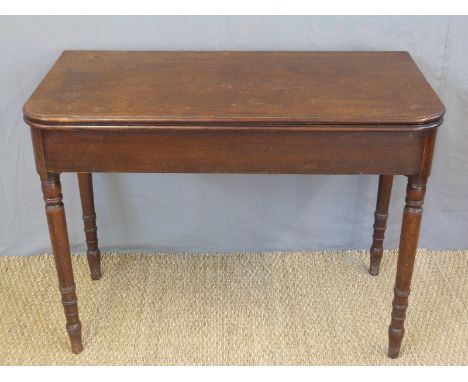 A Georgian mahogany fold over card or occasional table raised on turned legs, W100 x D50 x H75cm 