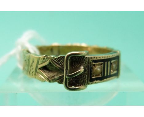 A 9ct gold Victorian mourning ring in the form of a buckle set with sections of plaited hair, black enamel and seed pearls 