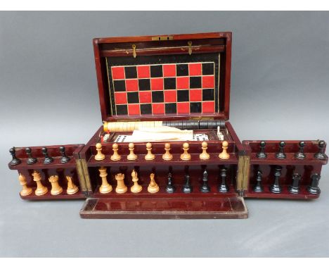 A late 19th/early 20thC games compendium, comprising chess, draughts, dice, backgammon, horse racing etc. in mahogany case, w