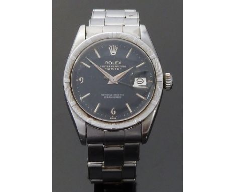 Rolex Oyster Perpetual Date gentleman's wristwatch with date aperture, dauphine hands, baton markers, black face, textured be