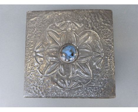 An Arts and Crafts pewter trinket box with applied likely Ruskin cabochon to lid, width 18cm
