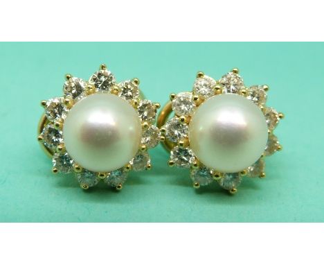 Mikimoto pair of 18ct gold earrings each set with a cultured pearl bordered by 11 round brilliant cut diamonds, total diamond