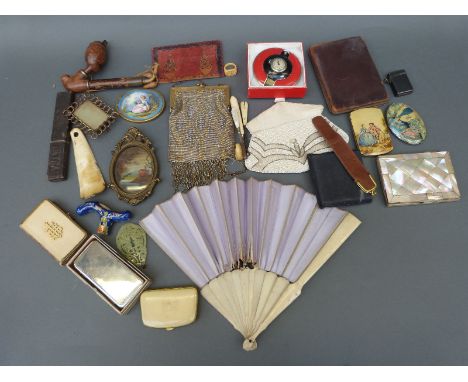 A quantity of collectables including mother-of-pearl purse, bone fan, jadeite pendant, pipe, purses, compacts, hip flask, Har