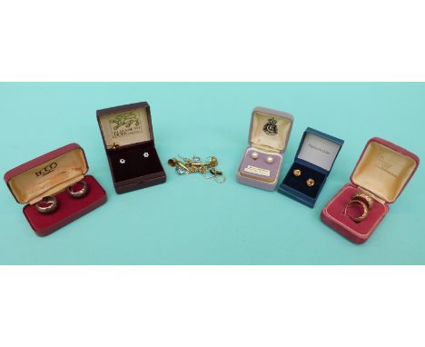 A collection of 9ct gold earrings including pearl, sapphire set and a pair in a knot design