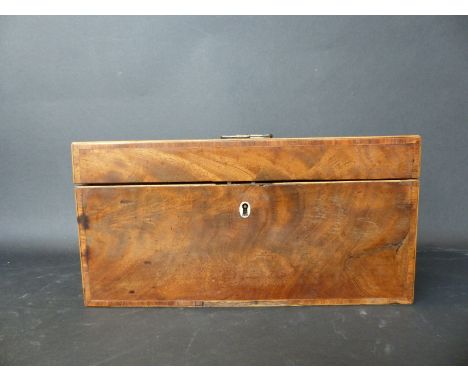 A Georgian flame mahogany tea caddy with banded inlaid decoration with internal fittings comprising a pair of boxes and a cut