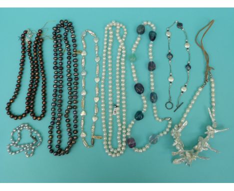 Ten pearl necklaces including four large single strands of freshwater pearls, a single strand of multi-coloured pearls etc