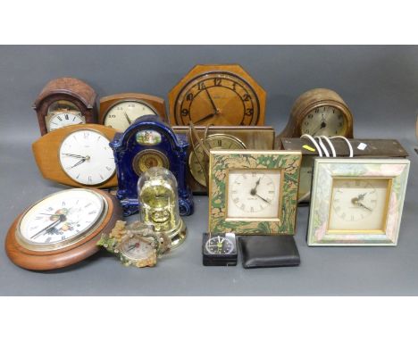 A collection of fifteen various clocks to include Smiths, Metamac, ceramic cased c1910 example, quartz etc