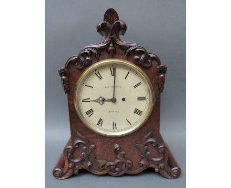 Chas Desprex Bristol bracket clock, the carved oak case with foliate decoration, double fusee movement striking on a gong, wi