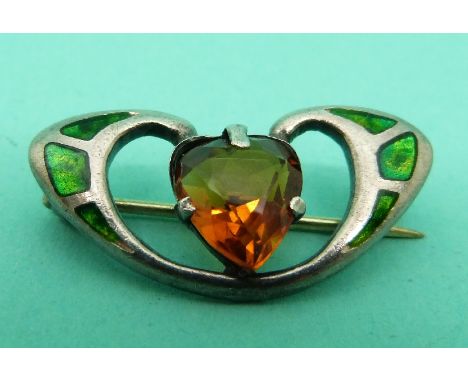 A hallmarked silver Charles Horner brooch set with green enamel and a heart cut citrine. 