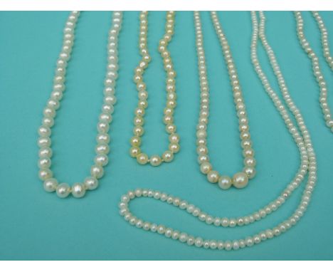 Seven pearl necklaces including a two strand pearl necklace with  9ct gold clasp, single strand cultured pearl necklace with 