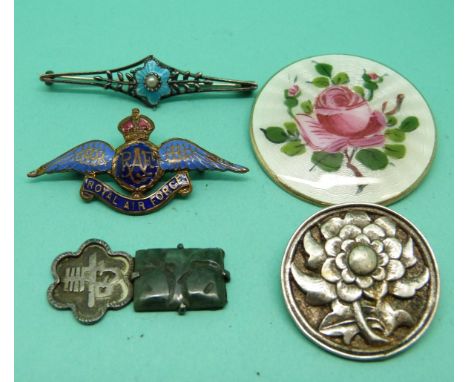 A silver Norway brooch set with guilloche enamel with painted flowers, a white metal brooch depicting a flower, an RAF brooch