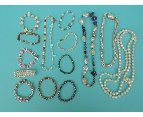 A large freshwater pearl necklace, four strand pearl necklace, irregular pearl and amethyst beaded necklace and 11 pearl brac