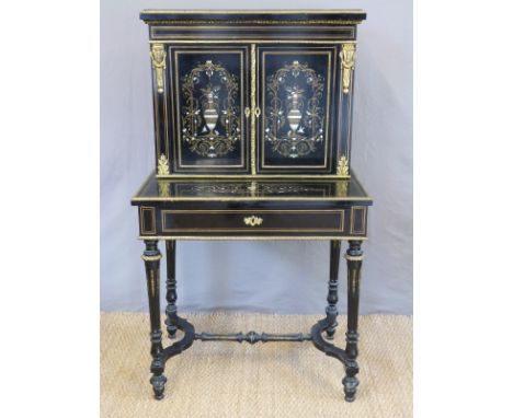 A continental 19thC ebony brass and mother of pearl inlaid gilt metal mounted bonheur du jour, the top opening to reveal bird
