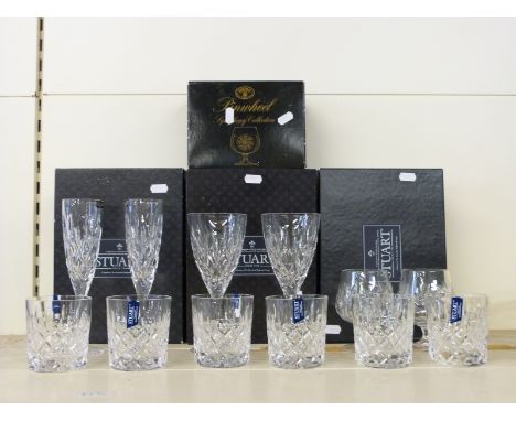 A set of six Stuart Crystal cut glass tumblers together with four matching wine glasses and a pair of Bohemia Pinwheel whisky