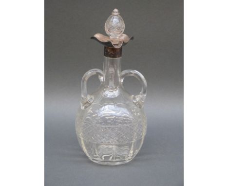 An Edward VII hallmarked silver mounted cut glass decanter with three handles and triform pouring spout, Chester 1906 maker B