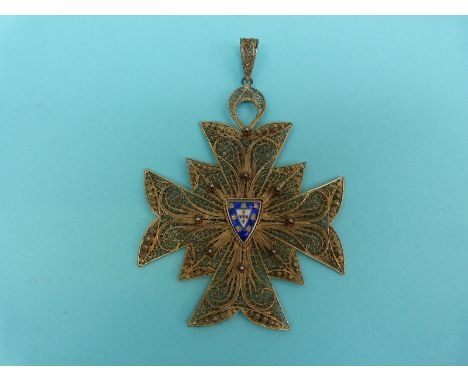 A silver gilt large filigree pendant in the form of a Maltese cross with blue and white enamel armorial crest to the centre, 