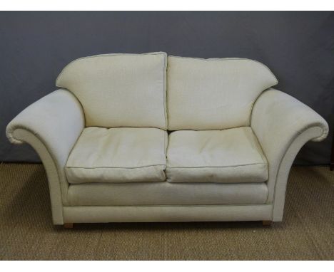 A pair of two seater sofas and a matching pouffe 