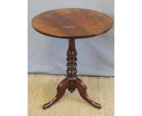 A 19thC mahogany table raised on a turned column and tripod base, diameter 57, H73cm 