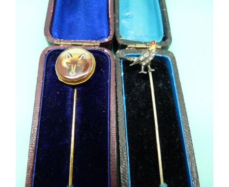 A stick pin depicting a fox's head and silver stick pin in the form of a pheasant set with enamel and paste