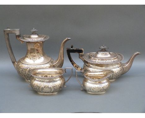 A George V Mappin & Webb hallmarked silver four piece tea service with embossed decoration, Sheffield 1910, weight 2058g all 