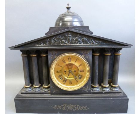 Victorian slate mantel clock in Romanesque style with triple columns either side and frieze decoration of battle scene to top