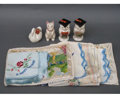 Two Carltonware pieces with lucky heather, one an owl and the other a dog, a Carltonware owl with Bridport crest and an Arcad