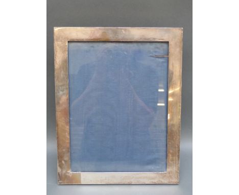 A large hallmarked silver photograph frame for 9x12" photo with velvet easel back, London 1910 maker Hewson & Williams