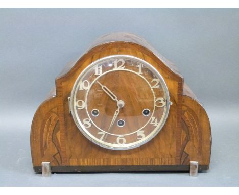 An Art Deco mantel clock with Haller three train movement, Arabic dials and inlay decoration to case