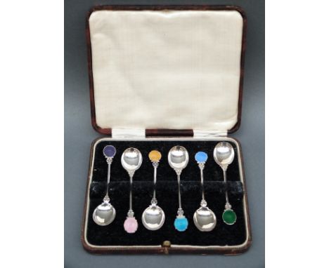 A cased set of six white metal and guilloche enamel teaspoons, marked sterling, weight 31g