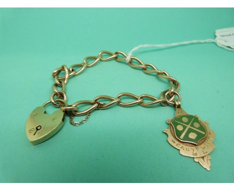An Edwardian curb link bracelet with a 9ct gold fob decorated with enamel and a 9ct gold heart padlock, weight 21.2g