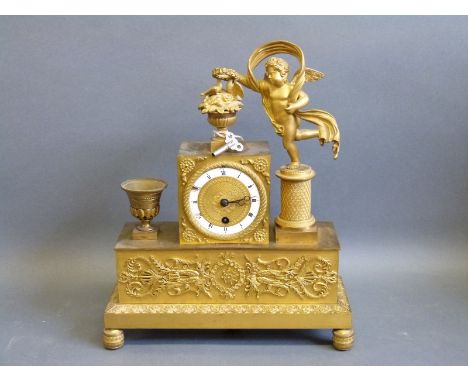 Late 19th Century French figural timepiece in classical style with cherubs and urns, the self coloured dial with Roman enamel