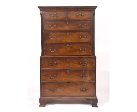 A LATE GEORGIAN MAHOGANY CHEST ON CHEST the upper section with fluted canted corners and standing on bracket feet, 110.5cm wi