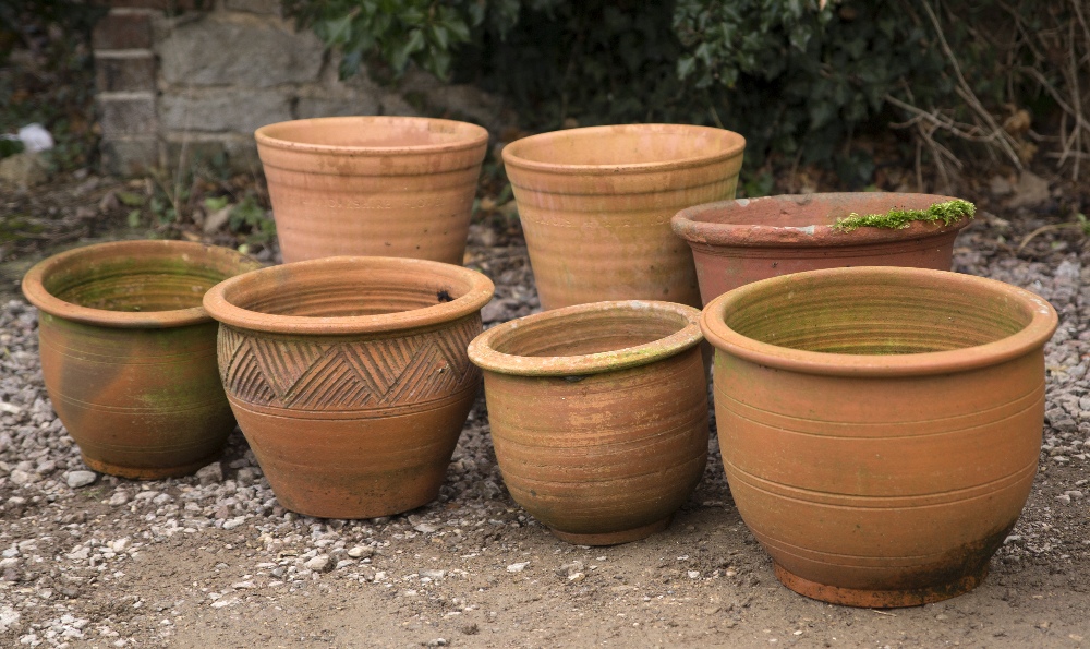 A SMALL COLLECTION OF TERRACOTTA PLANT POTS to include Yorkshire flower