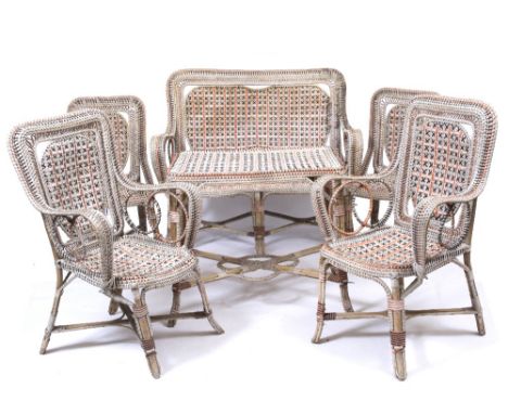 AN EARLY TO MID 20TH CENTURY POLYCHROME DECORATED RATTAN CONSERVATORY SUITE consisting of a two seater sofa, 122cm wide, a pa