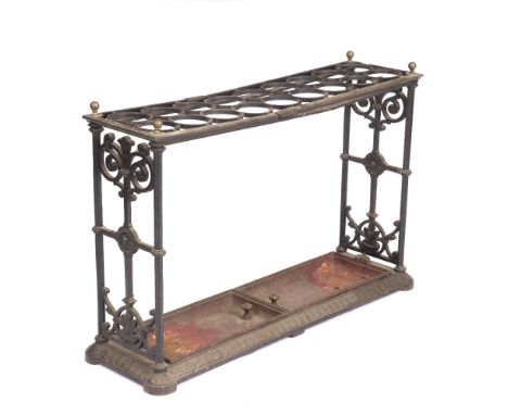 A VICTORIAN CAST IRON, POSSIBLY COALBROOKDALE, COUNTRY HOUSE STICK STAND with scrolling ends and decorated with flowerheads, 