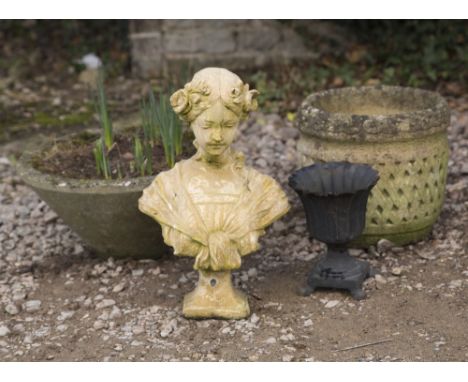 TWO CONCRETE PLANT POTS one of tapering form, the other of lattice work decoration, a cast iron Regency style planter and one