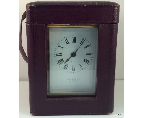 A French brass carriage clock and case supplied by John Bull - Bedford