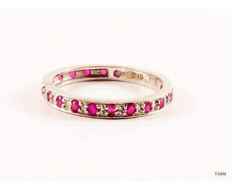 A 9ct white gold diamond and ruby eternity ring size L