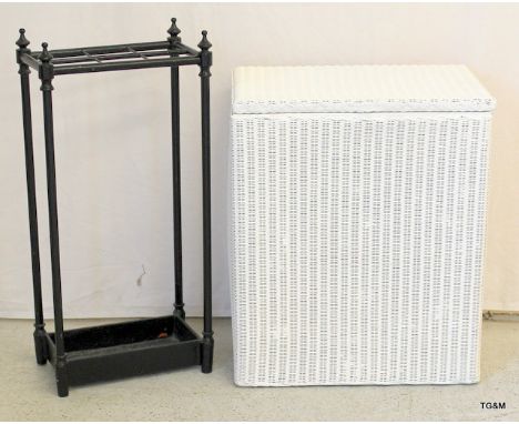 A Lloyd Loom laundry basket and a cast iron umbrella /stick stand 54 x 46 x 31cm and 65 x 31 x 17cm