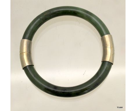 A jade and silver bangle