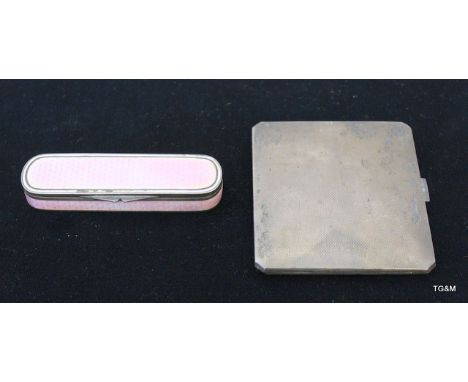 A silver cigarette case and silver engine turned enamel case