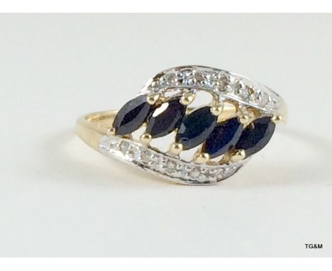 A 9ct gold ladies sapphire sweep over ring size p