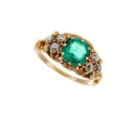 A emerald and diamond seven stone ring, the cushion shaped step cut emerald estimated to weigh 1.68 carats, within a claw set