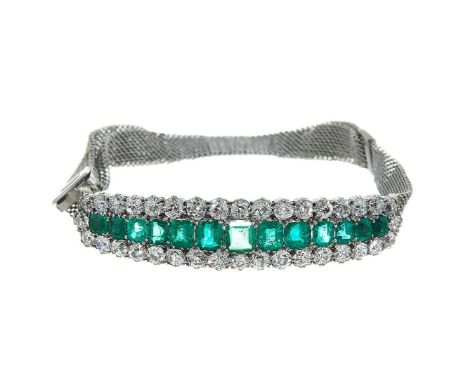 An emerald and diamond panel bracelet, the late Victorian panel with a central row of graduated step emeralds with canted cor